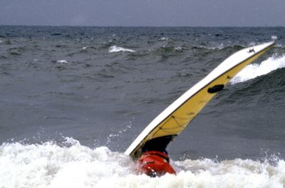 A photo of a kayak in the surf at the Gales of November.
